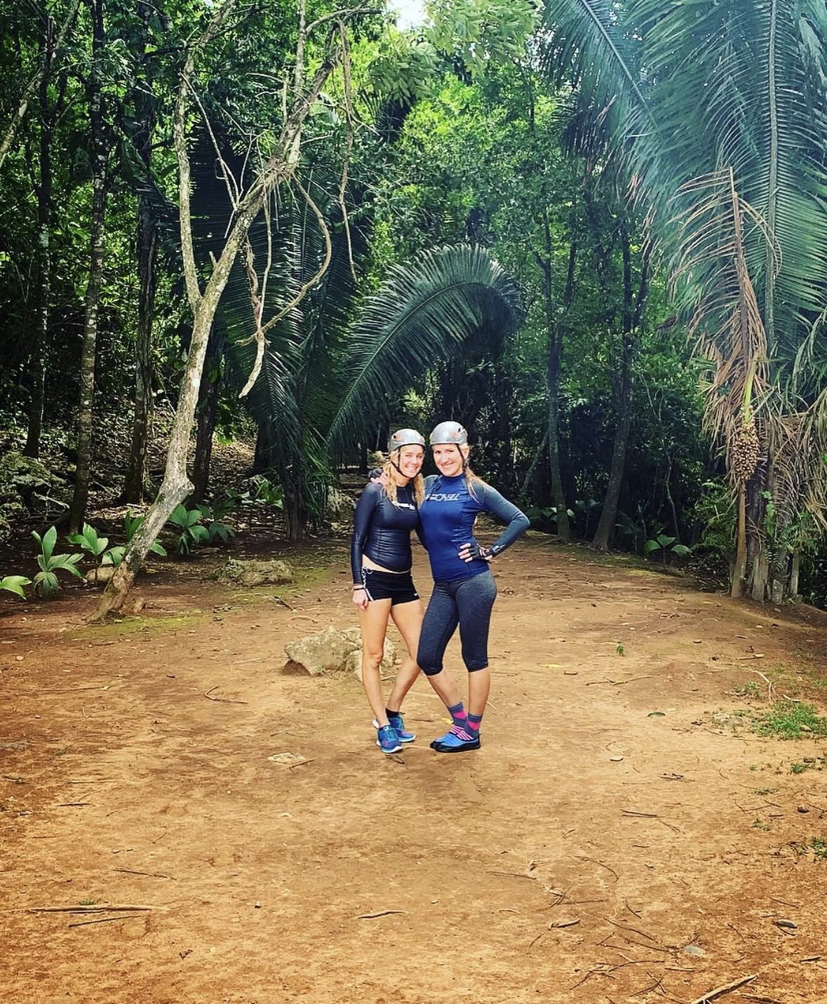 Lush Belizean jungle surrounding the ATM Cave Tour trail during the dry season